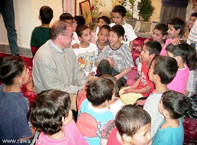  Mr. Javier Madrazo Lav�n a minister of Basque Government talking with a group of orphans