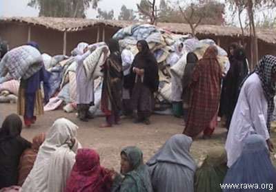RAWA activists distribute quilts among refugees
